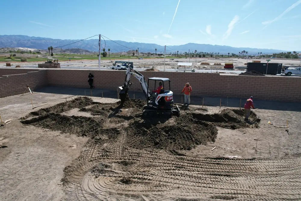 Excavator digging a new pool