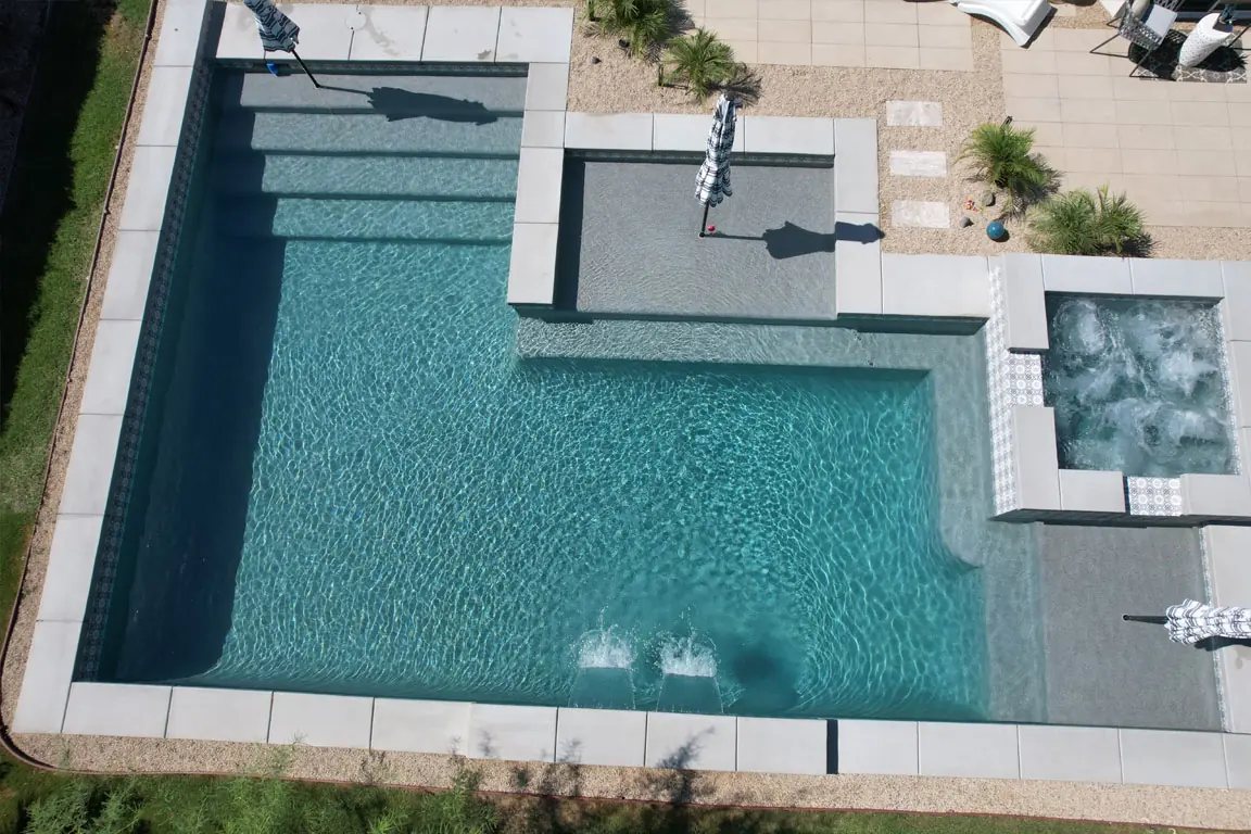 Aerial of a geometric pool with spa and sun shelf